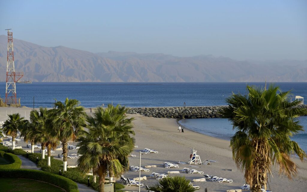 Exterior view of a large Fujairah hotel with landscaped grounds, ideal for a National Day break Fujairah.
