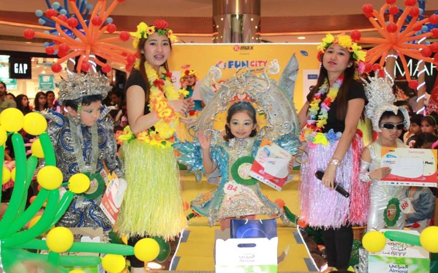 birthday kids with two female party hosts
