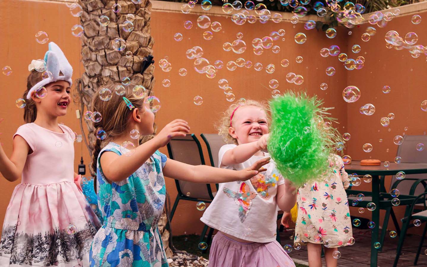 kids blowing bubbles