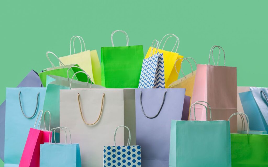 Shopping bags and gift boxes representing upcoming sales and offers in Abu Dhabi.