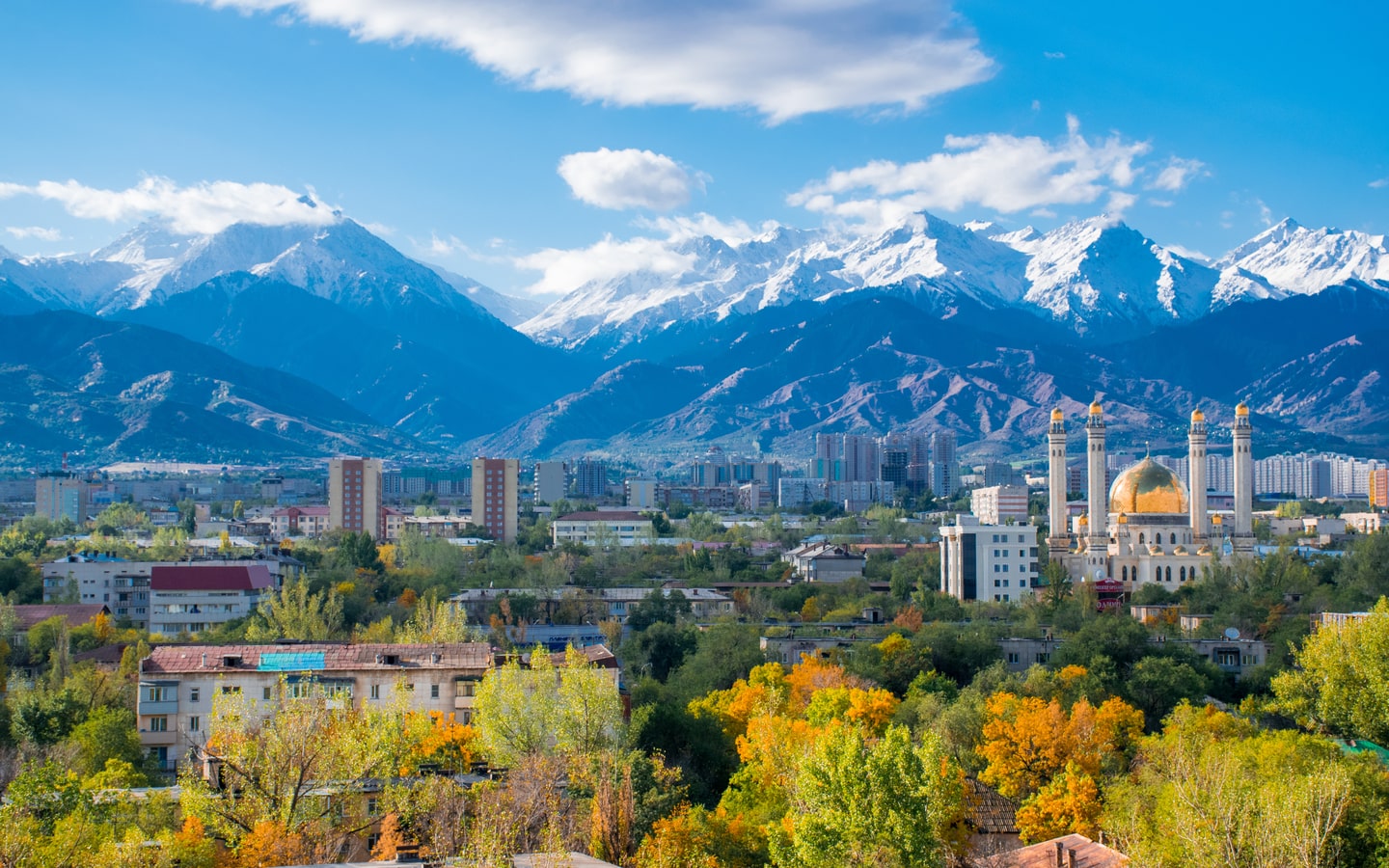 View of Almaty city and snow-capped mountains