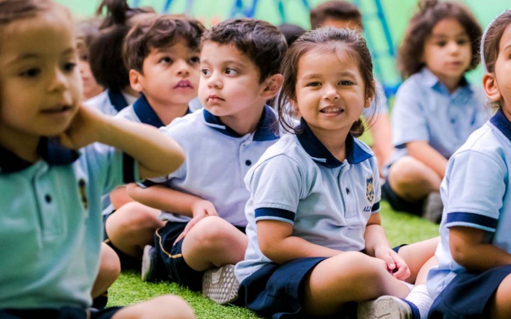 smiling schoolgirl from Alpha Pvt. School RAK