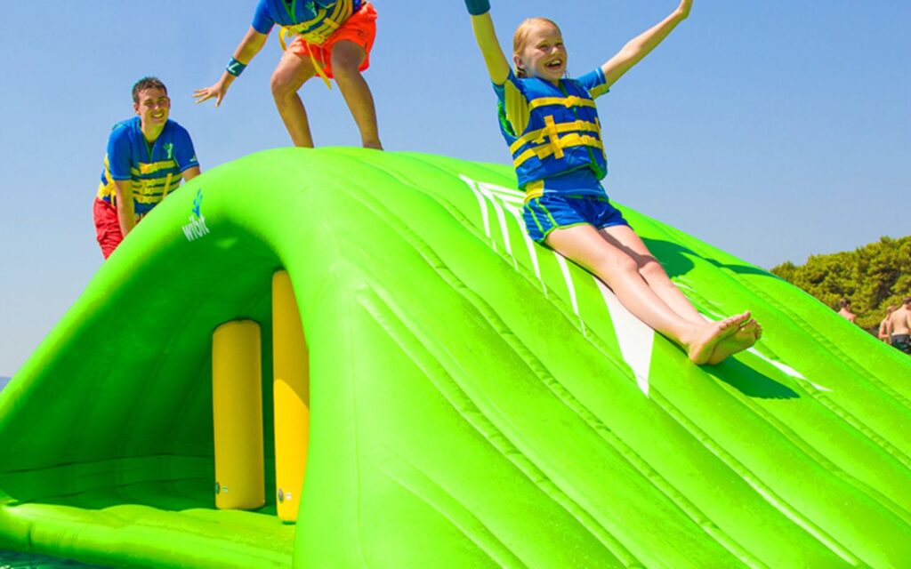 Aqua Bounce inflatable obstacle water park floating in Ajman sea