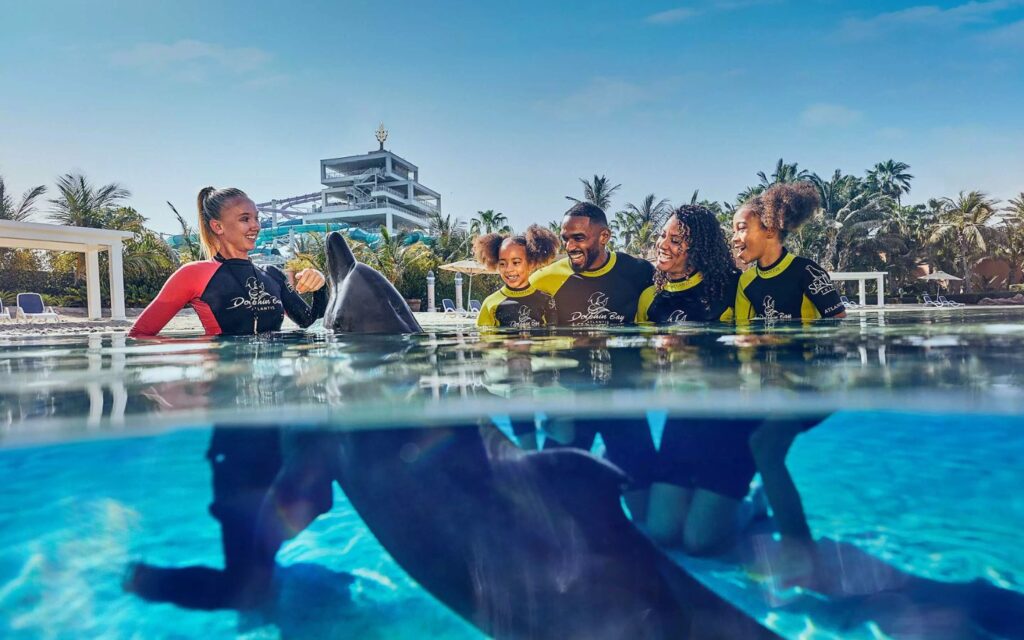 Get up close with friendly dolphins at Aquaventure’s Dolphin Bay