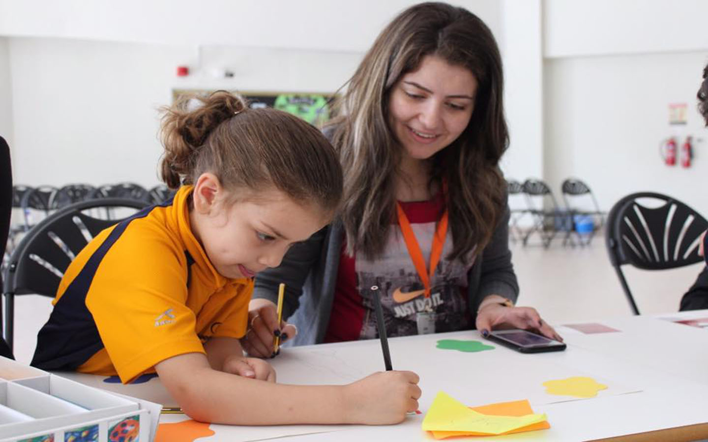Teacher while guiding a student at Aspen, Abu Dhabi