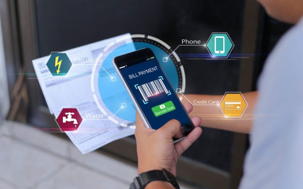 Person paying utility bills through mobile app in Sharjah