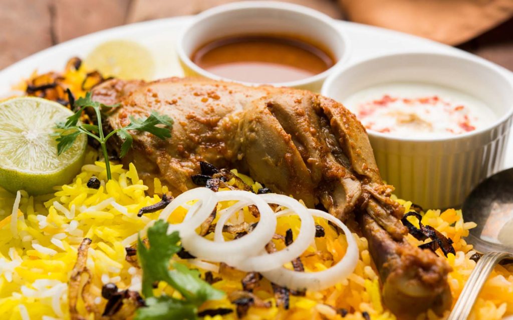chicken biryani with raita and salad