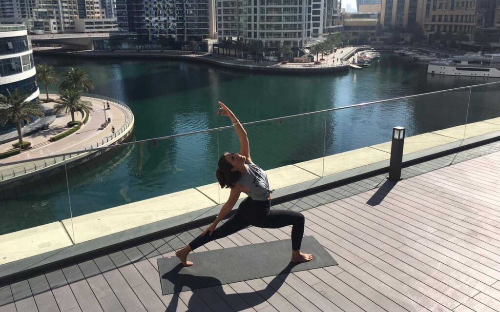 Woman at a yoga class in Dubai Marina