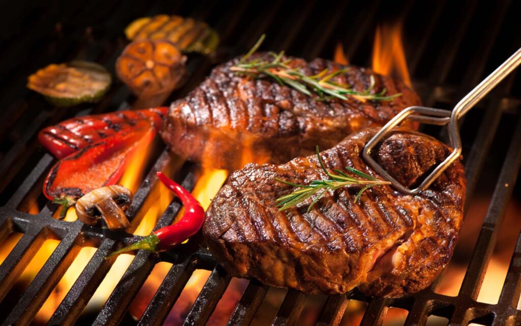 Grill meat at one of the best brunches in Dubai
