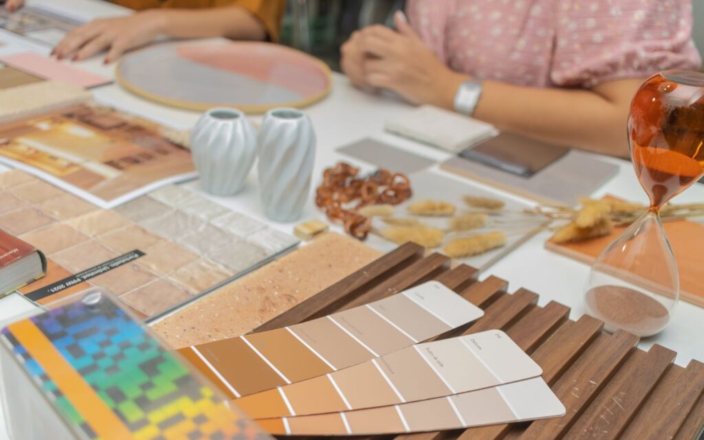 Designers reviewing mood boards, materials and concept ideas for luxury residential interior.