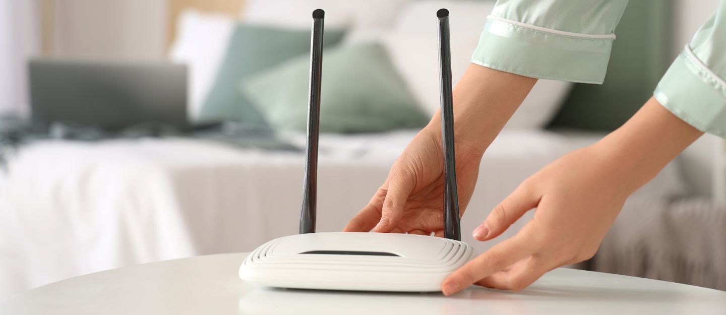 A person setting up a internet device to move home internet in the UAE during relocation.