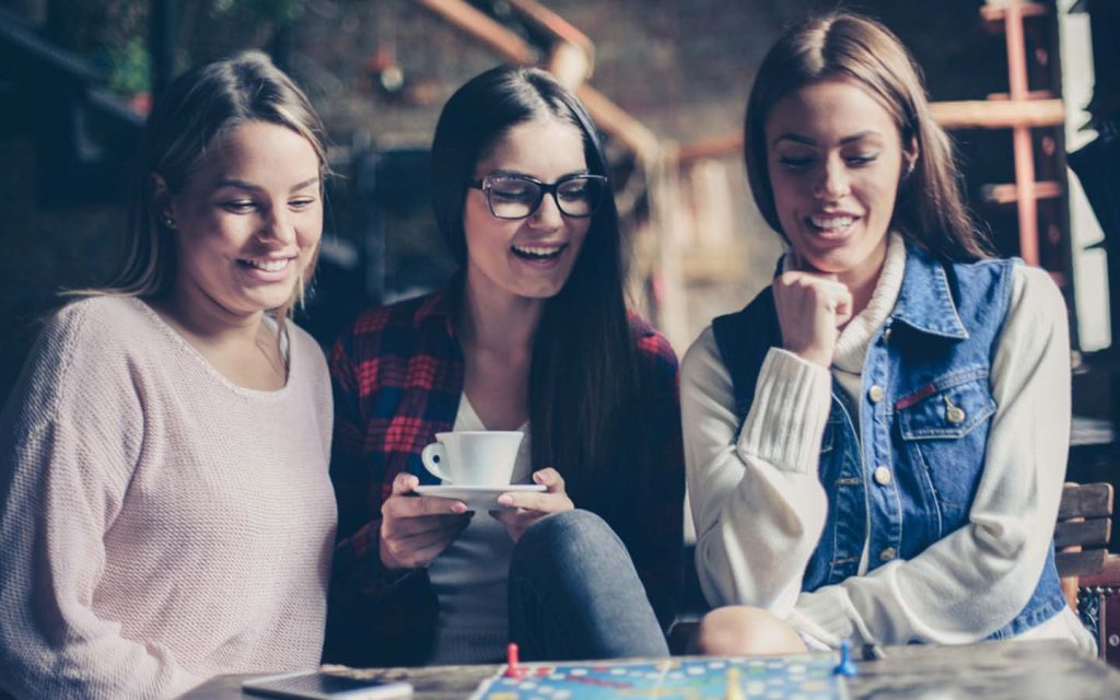 Girls at one of the board game cafes in Dubai