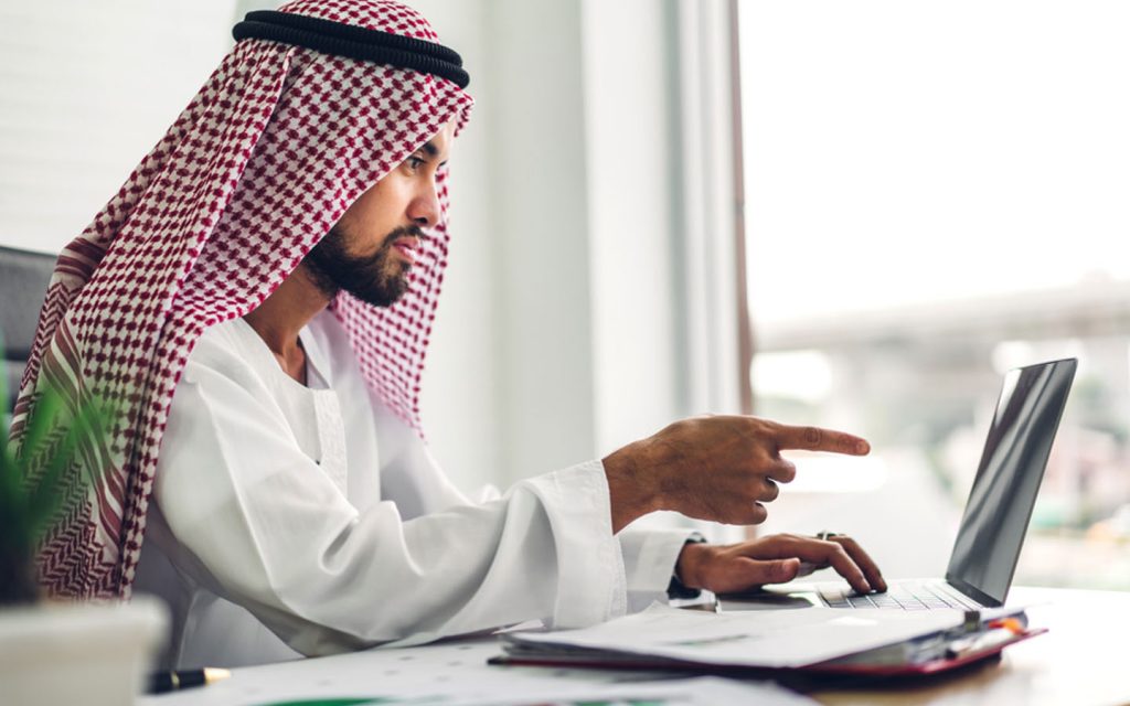Man working on a laptop in an office