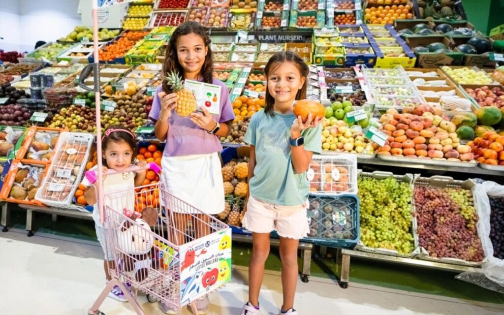 Kids at Fruits and Vegetable section of family market in Dubai