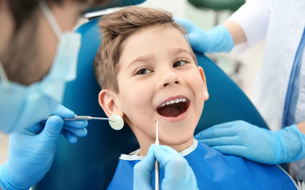 Dentist treating child