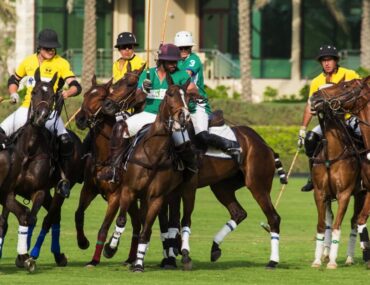 People playing polo in Desert Palm Polo Club in Dubai