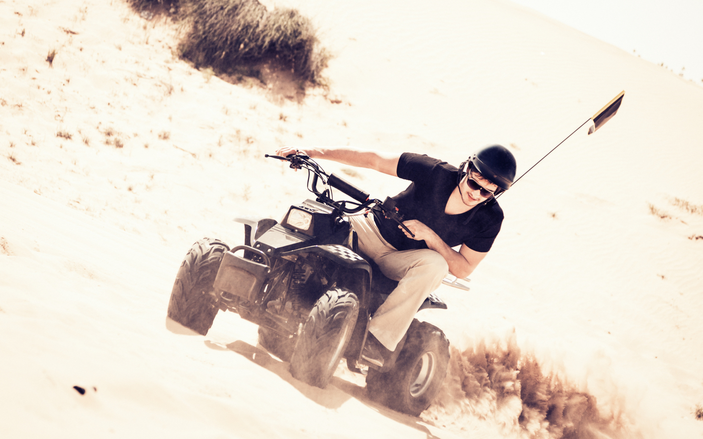Man Quad biking in Dubai desert