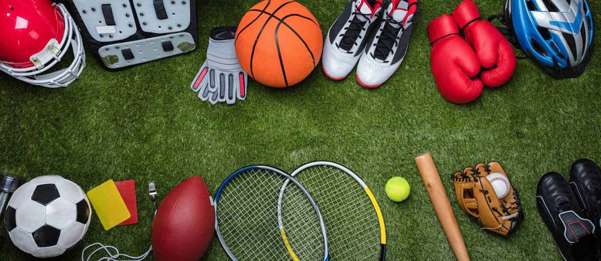Various sports equipment on grass in Dubai Sports World