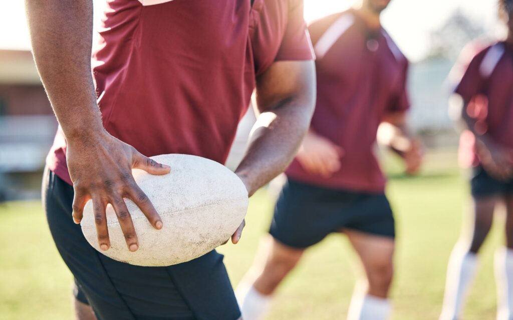 Player holding a rugby ball