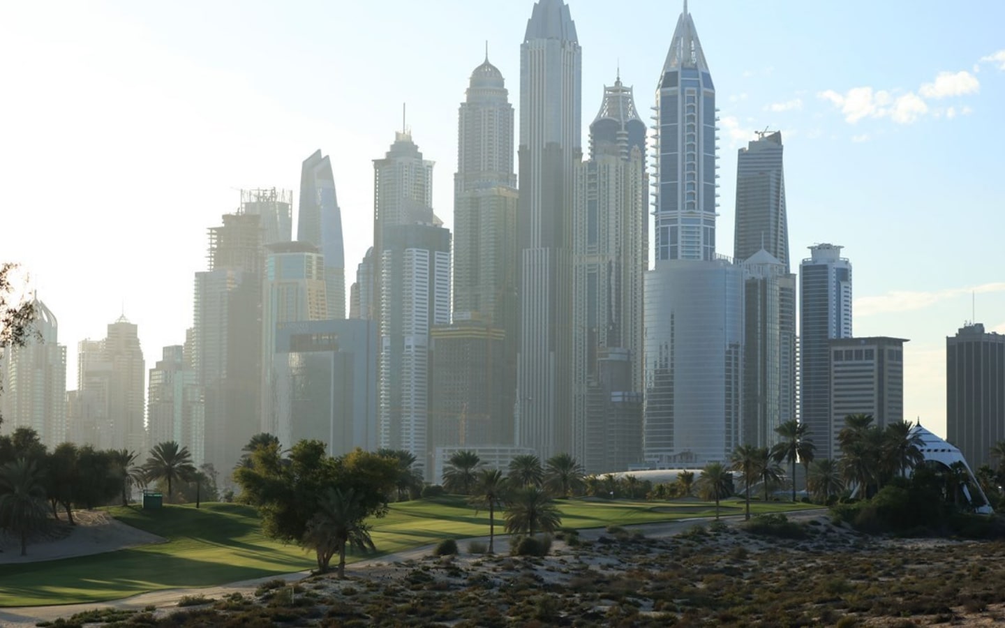 View of Emirates Golf Club and Dubai marina skyline