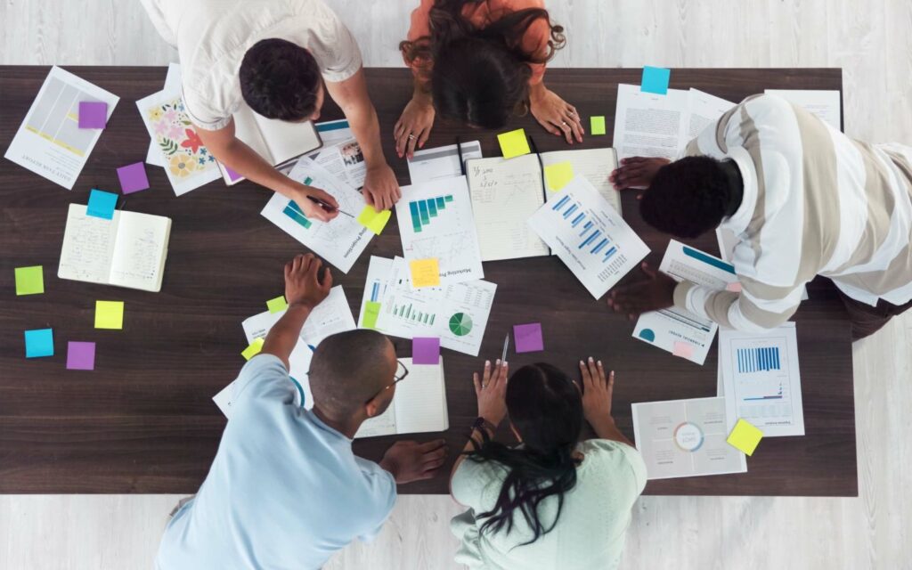 Event staff coordinating logistics with a list of event management companies in Abu Dhabi.