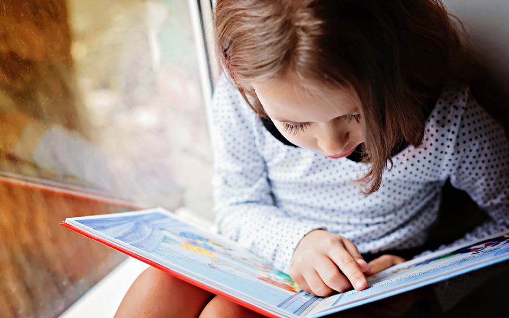 girl is reading a book