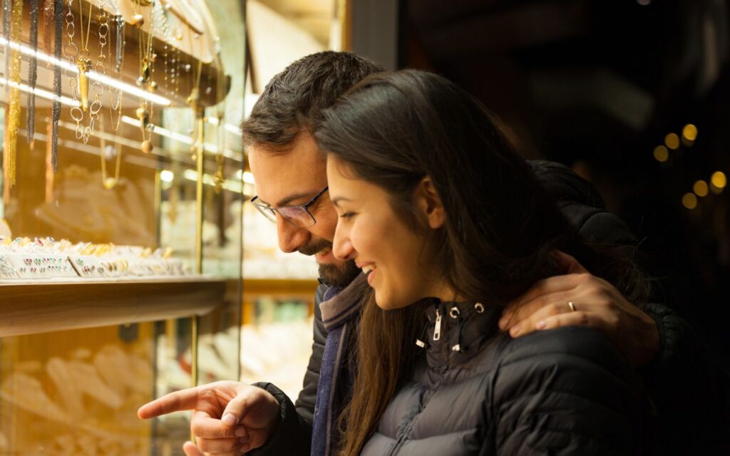 Couple looking at a gold display