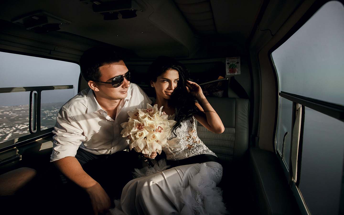 A newly wedded couple on a helicopter