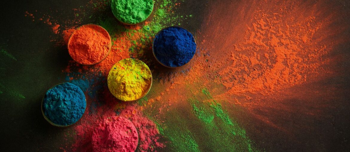 Brightly coloured powders arranged in bowls ready for throwing during the Holi festival in Dubai