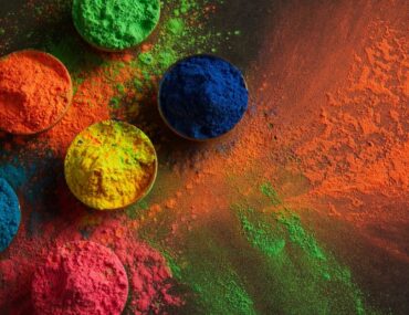 Brightly coloured powders arranged in bowls ready for throwing during the Holi festival in Dubai