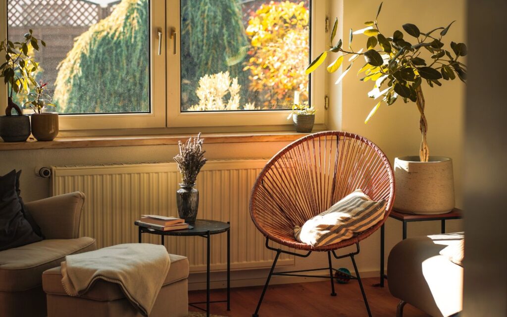 Cozy reading corner with soft furnishings fostering a peaceful home environment.