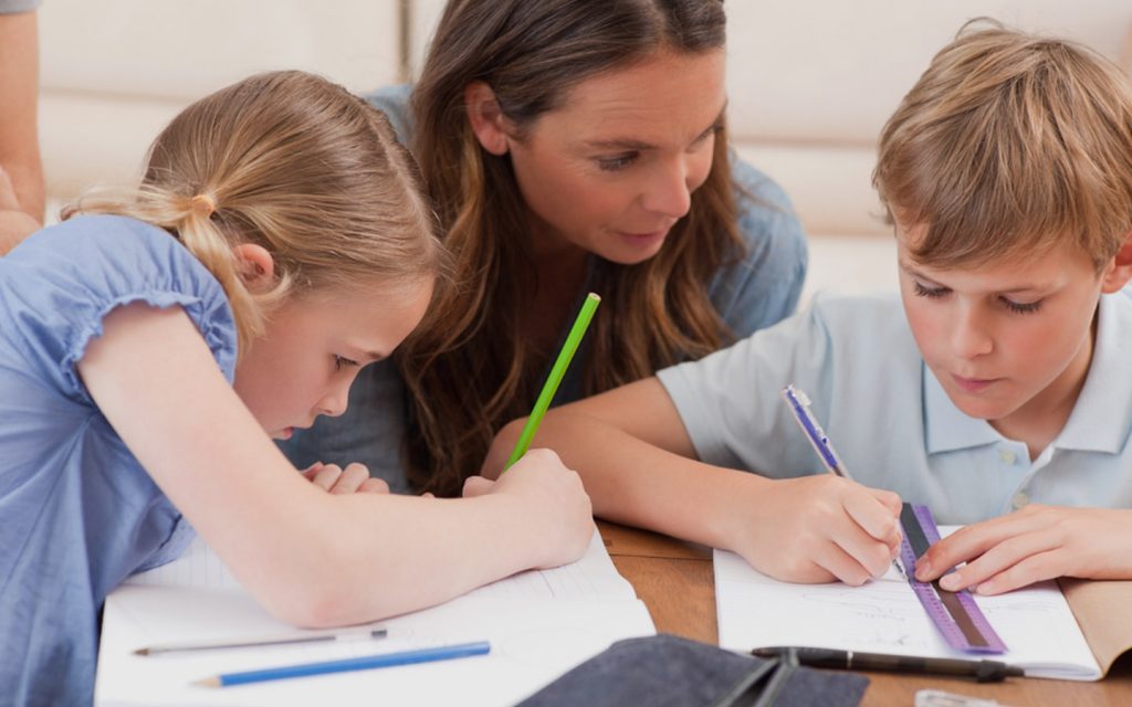 Mother teaching her children