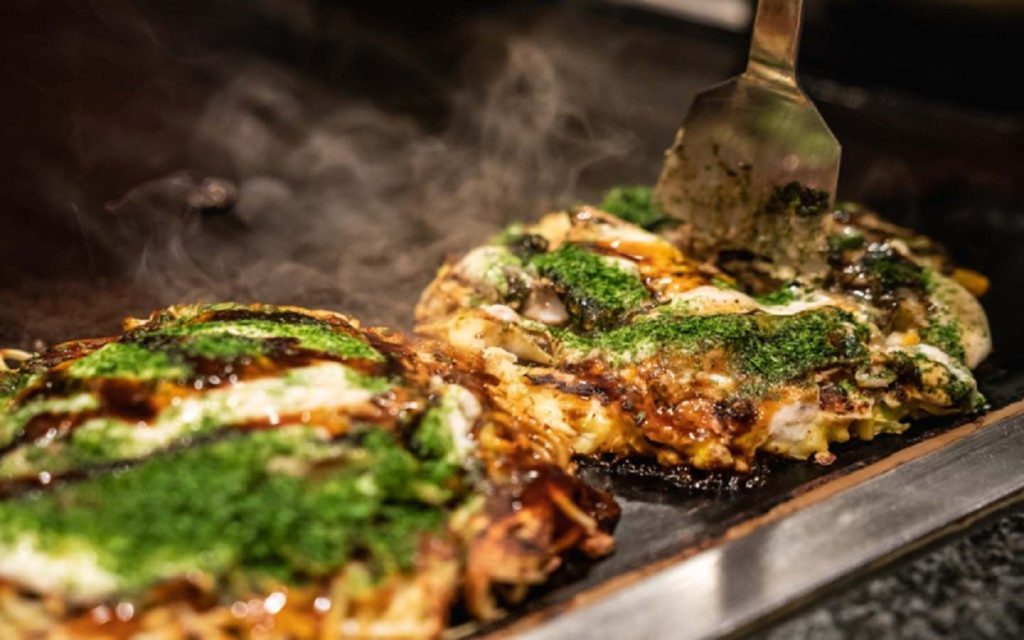 Okonomiyaki served hot in a Japanese restaurant
