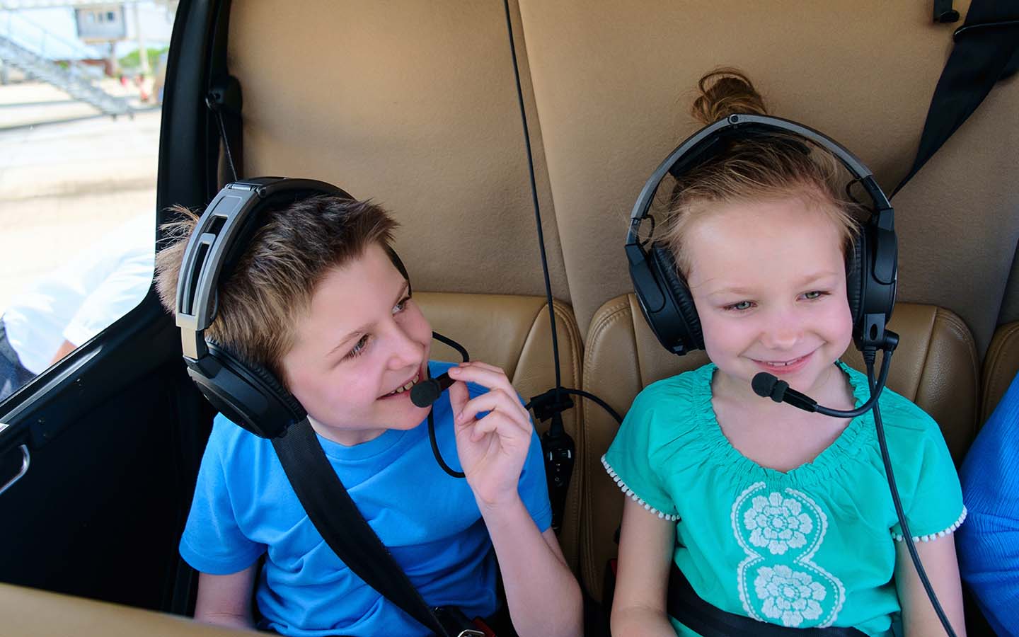 Kids sitting in a helicopter