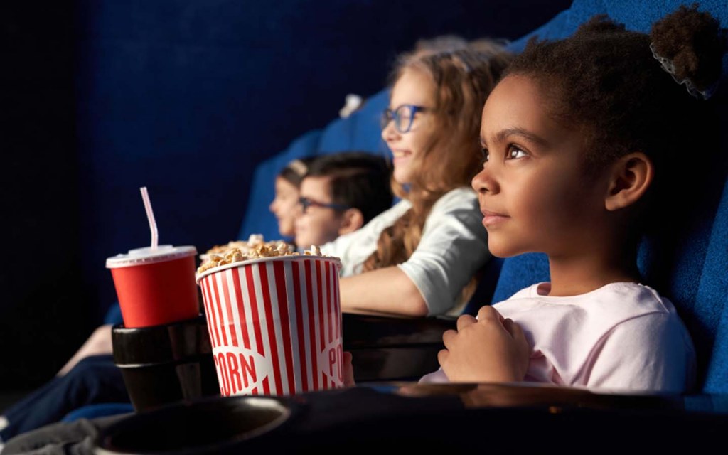 Kids watching a film in cinema