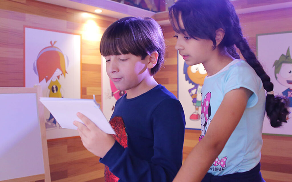 Children enjoying various interactive role-play activities at KidZania Dubai, a mini city designed for kids to learn and have fun.