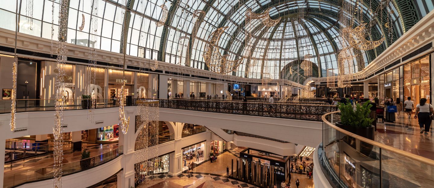 Interior view of Mall of the Emirates with crowds and shops.