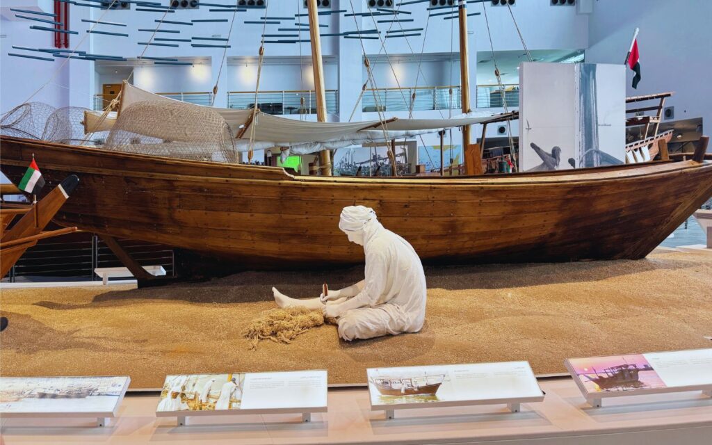 Historical maritime artefacts, old sailing equipment and preserved cultural displays in museum exhibition space
