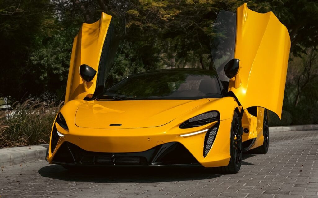 Stylish luxury car in Dubai cityscape, part of luxury car rentals in Dubai by Master Key