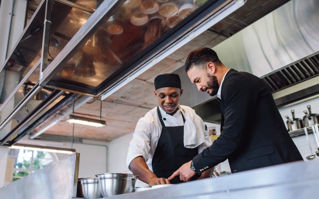 a restauranteur with chef at a Dubai restaurant