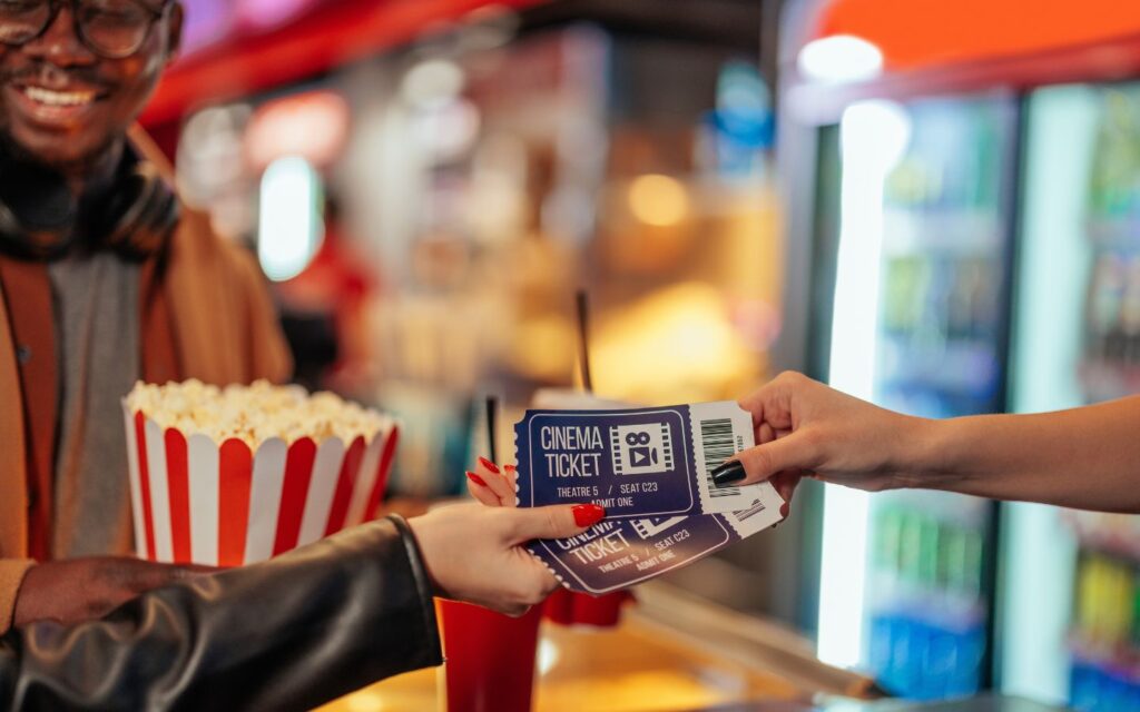 Handing out movie tickets