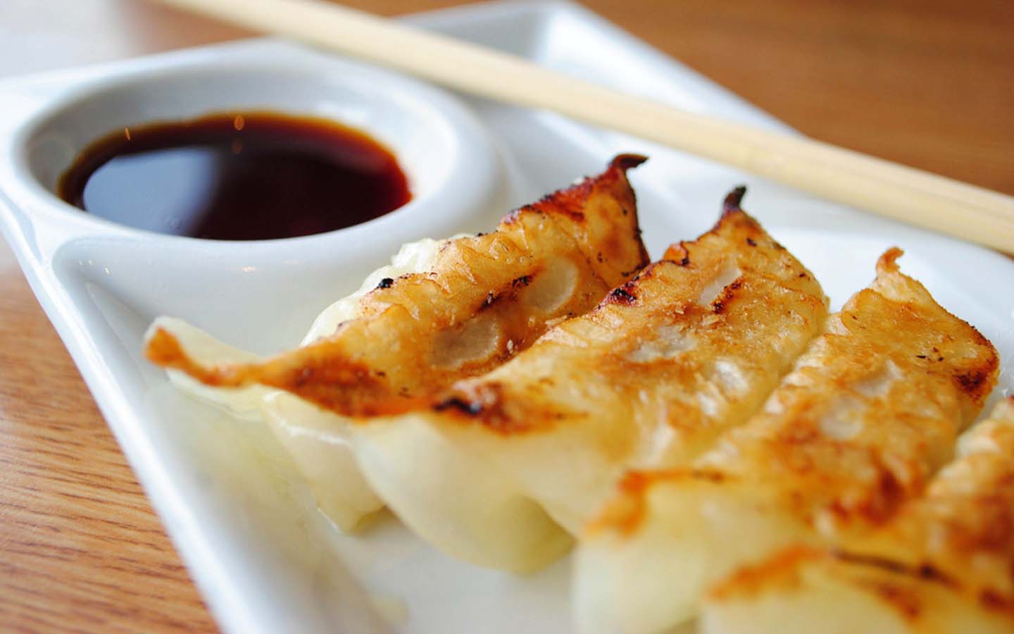 Pan Fried gyozas served with soy sauce