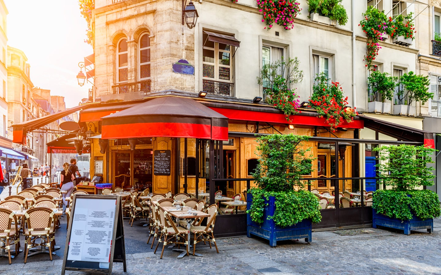 Cafe with outdoor seating on a street in Paris