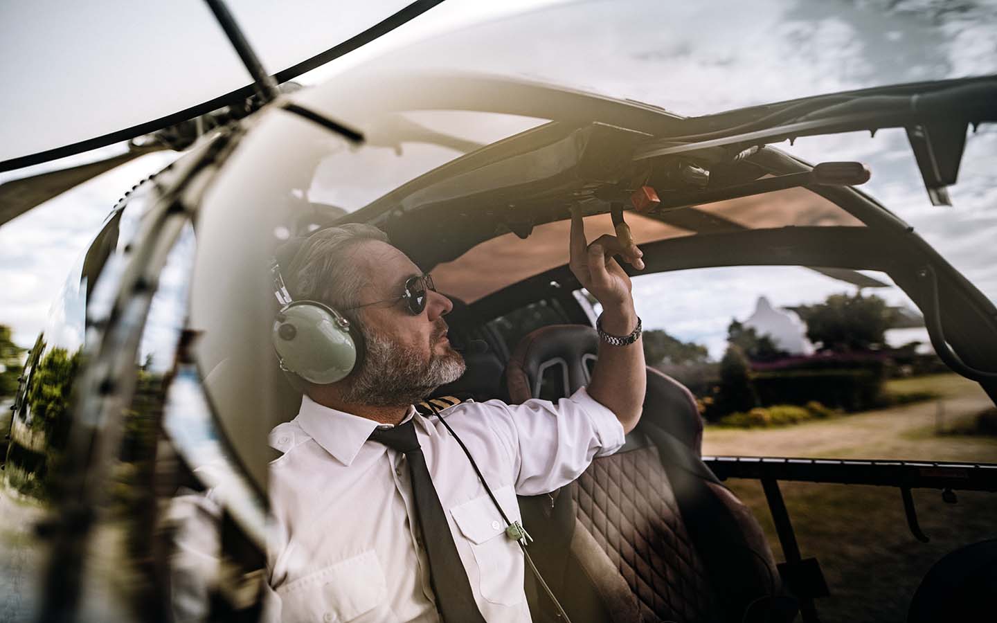 A pilot readies a helicopter for Atlantis Helicopter tours