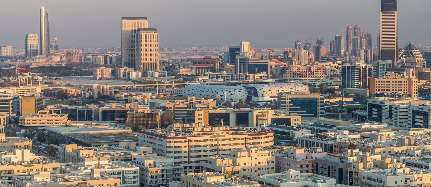 Aerial view of Deira neighborhood, showing dense buildings, roads, and surrounding urban areas