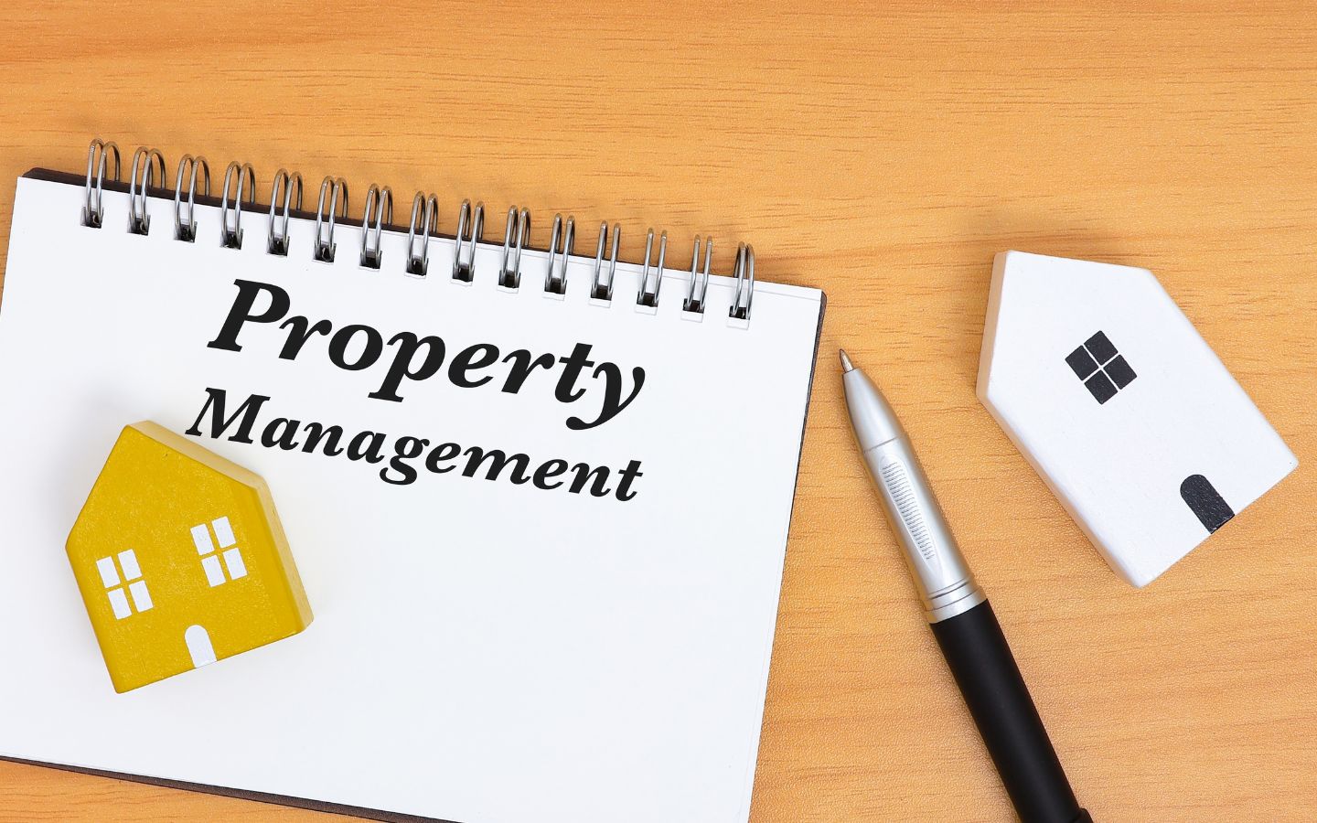 Property management calendar pen and a decorative house 