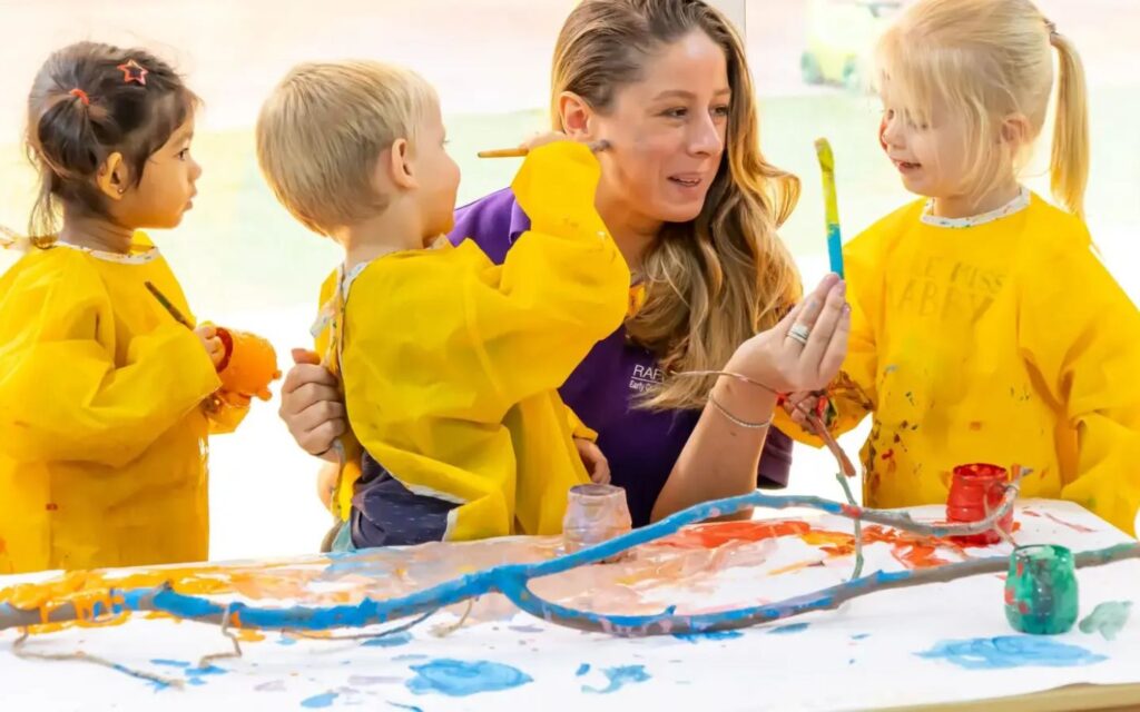 Kids having creative time with their teacher in one of the best nurseries of Dubai