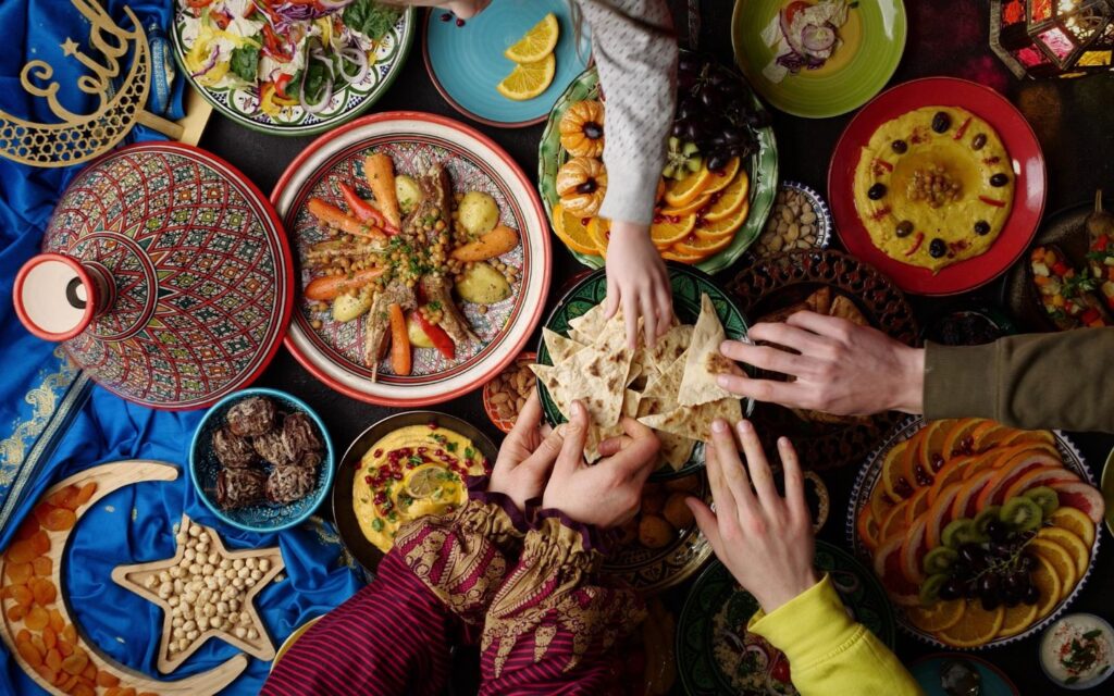 A high-end buffet setup at the best Iftar restaurants in Palm Jumeirah overlooking the city skyline.