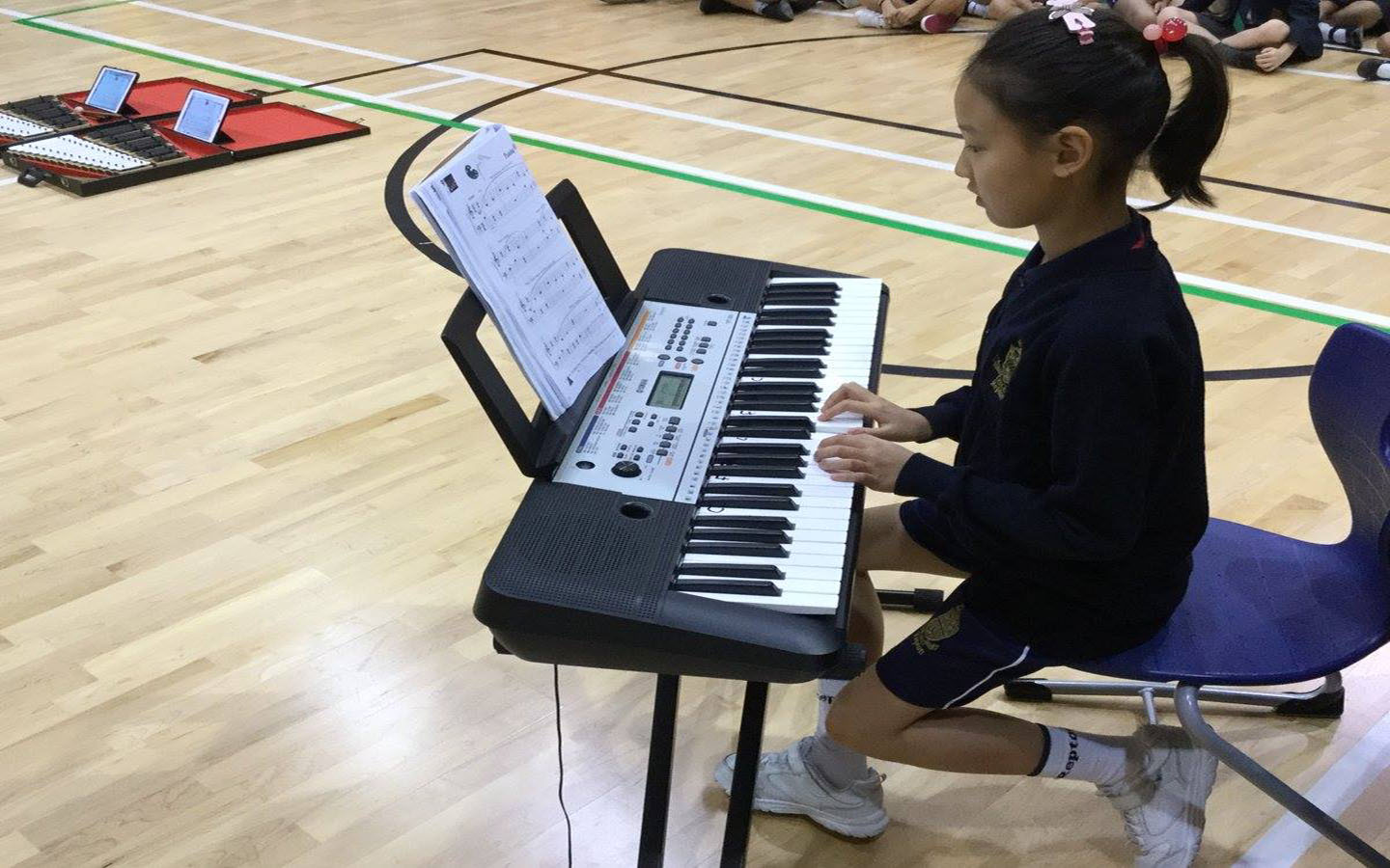 A girl playing piano at Repton School