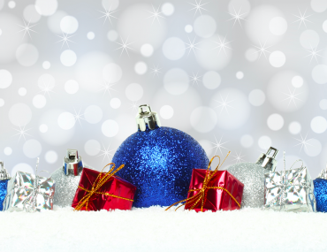 Christmas Decoration Ideas Blog Cover: Blue, red and silver Christmas ornaments against on crisp white snow against a sparkly gray background